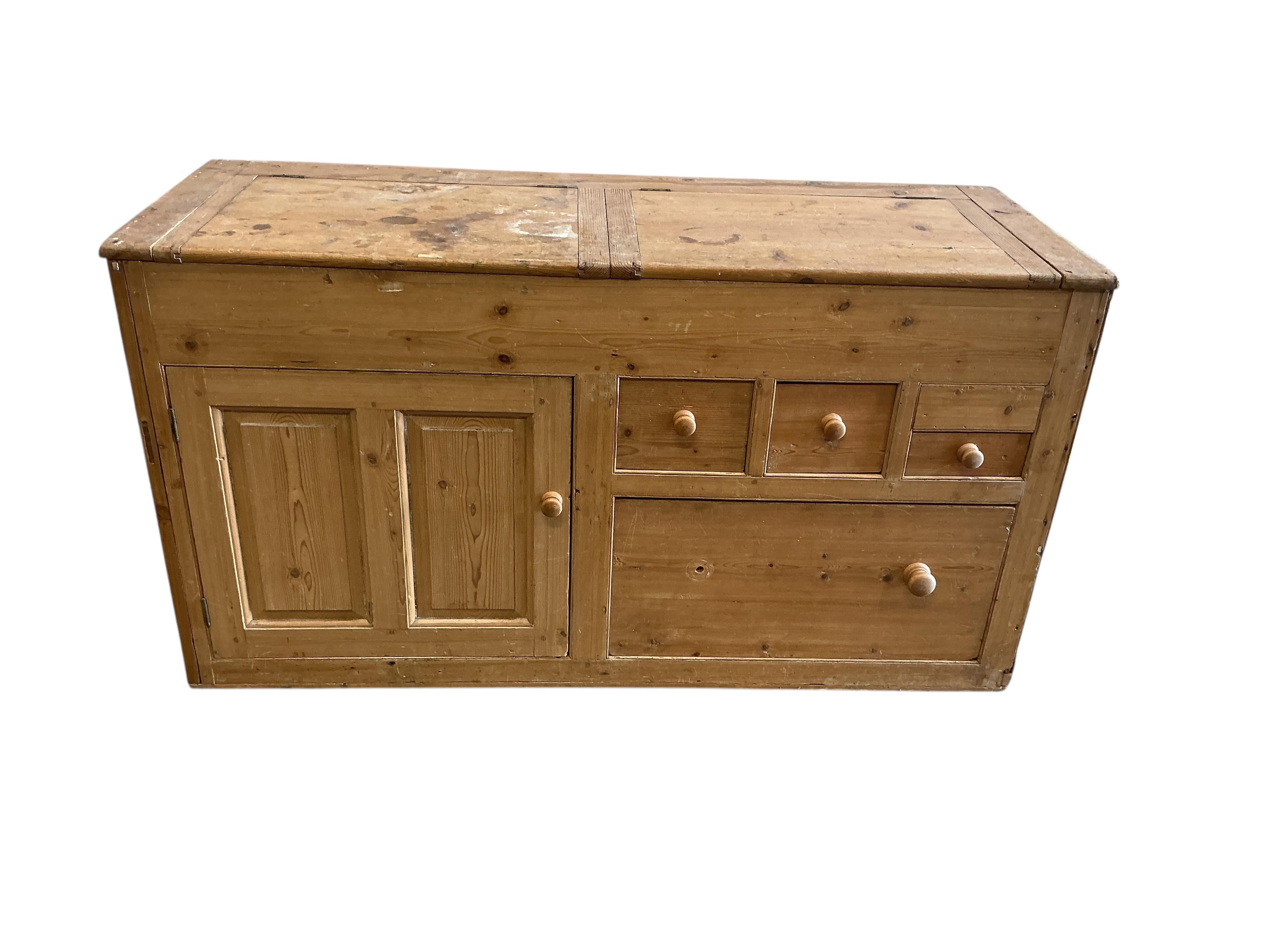 A Victorian pine low dresser with twin hinged compartment top, width 150cm, depth 53cm, height 80cm